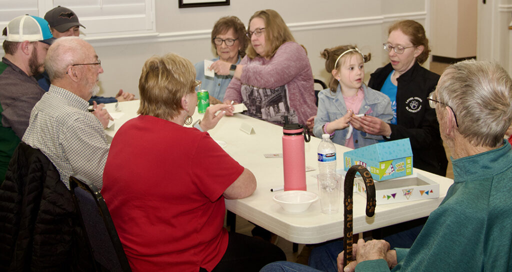 multigenerational families enjoy a variety of games at Kernersville Moravian Church game night